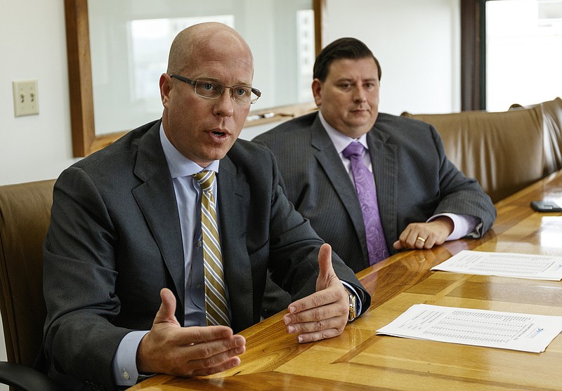 Tennessee Recovery & Monitoring President Andy Baggenstoss, left, and Vice President Scott Cranmore talk about their company in the offices of Waterhouse Public Relations on Friday, July 28, 2017, in Chattanooga, Tenn. The company offers monitoring systems in place of incarceration or high bails for offenders.