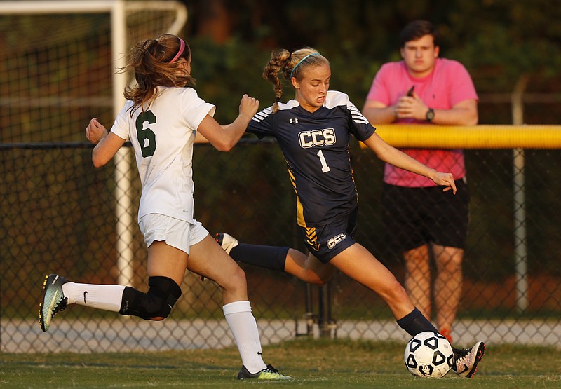 Chattanooga Christian School's Laura Beth Turner, right, shoots around Notre Dame's Hannah Ingle during Thursday night's match at Notre Dame. CCS scored both goals in the second half of its 2-0 win in Division II-A East competition.