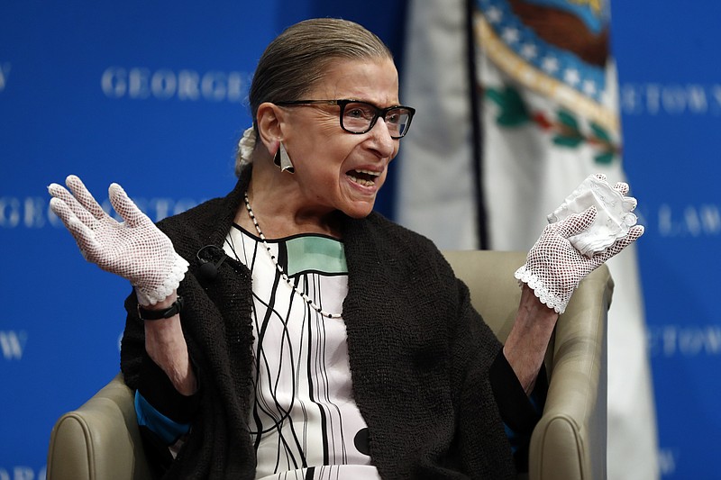 
              U.S. Supreme Court Justice Ruth Bader Ginsburg reacts to applause as she is introduced by William Treanor, Dean and Executive Vice President of Georgetown University Law Center, at the Georgetown University Law Center campus in Washington, Wednesday, Sept. 20, 2017. (AP Photo/Carolyn Kaster)
            