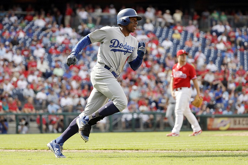 
              Los Angeles Dodgers' Curtis Granderson, left, rounds the bases after hitting a home run off Philadelphia Phillies pitcher Mark Leiter Jr. during the sixth inning of a baseball game, Thursday, Sept. 21, 2017, in Philadelphia. Los Angeles 5-4. (AP Photo/Matt Slocum)
            