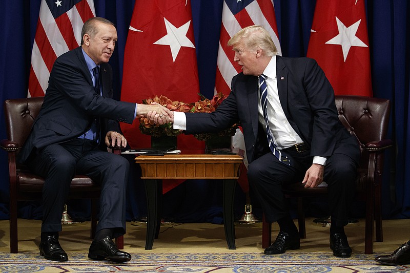 
              President Donald Trump shakes hands with Turkish President Recep Tayyip Erdogan during a meeting at the Palace Hotel during the United Nations General Assembly, Thursday, Sept. 21, 2017, in New York. (AP Photo/Evan Vucci)
            
