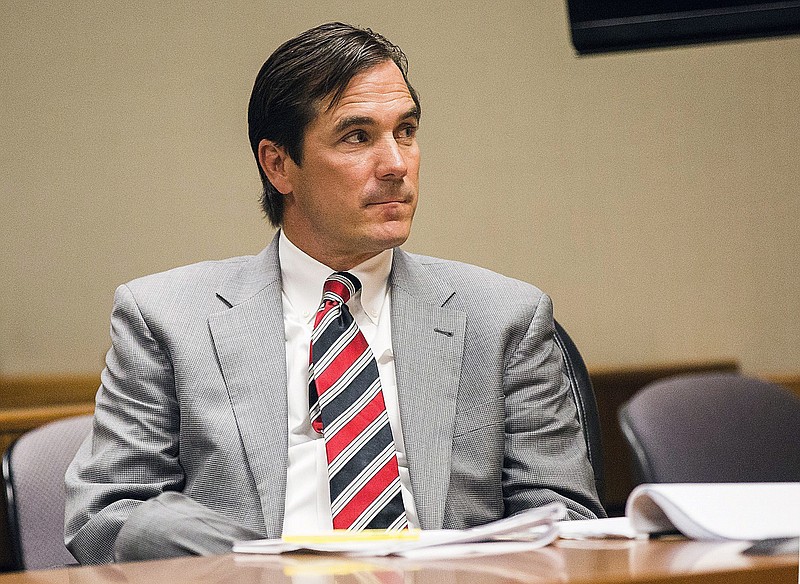
              FILE - In this Aug, 10, 2017, file photo, Nick Lyon, director of the Michigan Department of Health and Human Services, appears in Genesee County District Court in Flint, Mich. Lyon, who is blamed in the death of a Flint-area man who had Legionnaires' disease faces a key hearing starting Thursday, Sept. 21, 2017, to determine whether he will stand trial for involuntary manslaughter. He's accused of failing to alert the public in a timely manner about a Legionnaires' outbreak in the Flint area in 2014-15. (Terray Sylvester/The Flint Journal-MLive.com via AP, File)
            