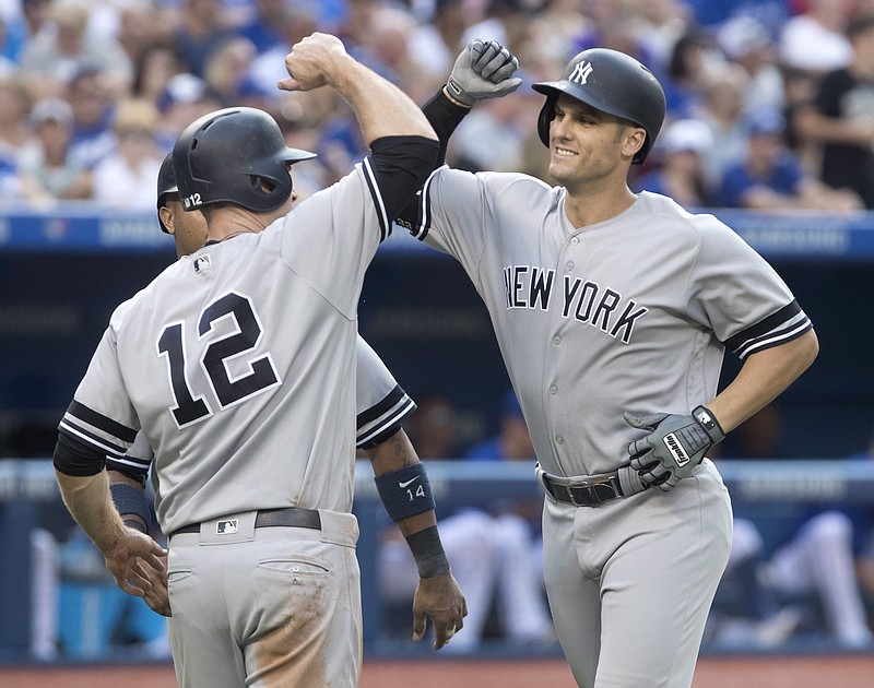 Yankees beat Blue Jays to clinch playoff berth