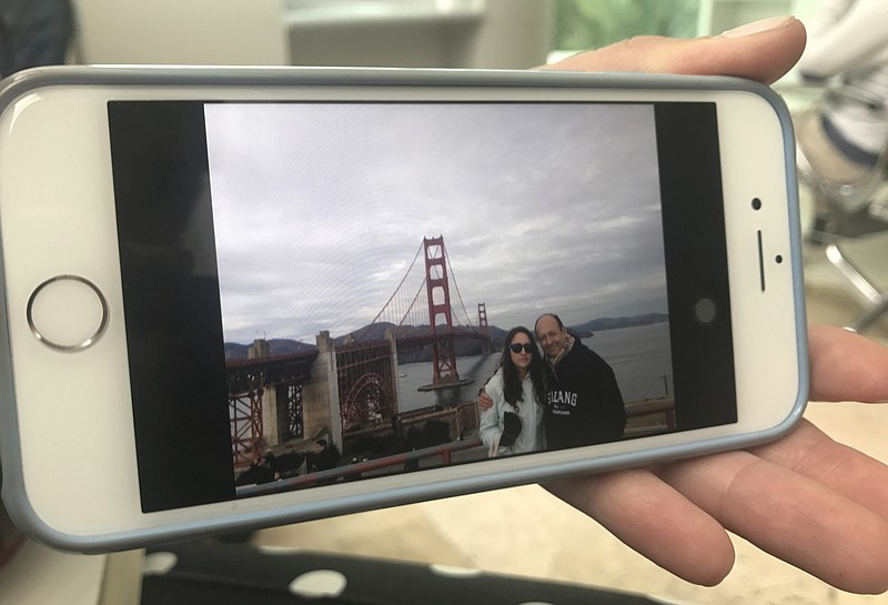 
              This photo released by Claudia Ponce Orozco on Sept. 23, 2017 shows her father Jose Luis Ponce posing for a photo with her in front of San Francisco's Golden Gate Bridge in California. Claudia said her father was pulled alive from the rubble of his nine-story Mexico City apartment building 26 hours after it collapsed following a 7.1-magnitude earthquake on Sept. 19 in Mexico City. “You said you would be with me always,” his daughter, Claudia Ponce, 30, told him. “Now is not the moment to leave.” (Claudia Ponce Orozco via AP)
            