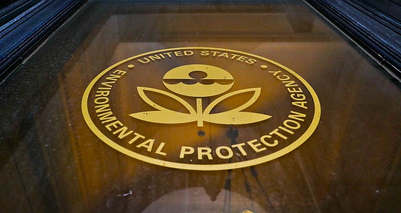 
              In this Sept. 21, 2017, photo, a sign on a door of the Environmental Protection Agency in Washington. The EPA says it has recovered 517 containers of “unidentified, potentially hazardous material” from highly contaminated toxic waste sites in Texas that flooded last month during Hurricane Harvey. But the agency has not provided details about which Superfund sites the material came from, why the contaminants at issue have not been identified and whether there’s a threat to human health. (AP Photo/Pablo Martinez Monsivais)
            