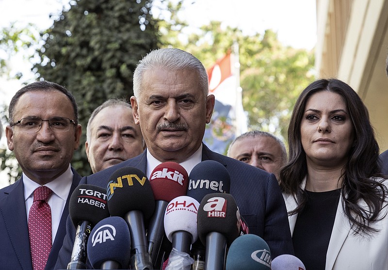 
              Turkish Prime Minister Binali Yildirim speaks to the media in Ankara, Turkey, Friday Sept. 22, 2017. Yildirim said Friday his country will never accept a separate Kurdish state in neighboring Iraq and would not refrain from taking steps to prevent it. Binali Yildirim again called on Iraqi Kurdish leaders to abandon plans for a referendum on independence, saying it was not too late for them to turn away "from this adventure." (Turkish Prime Ministry, pool photo via AP)
            