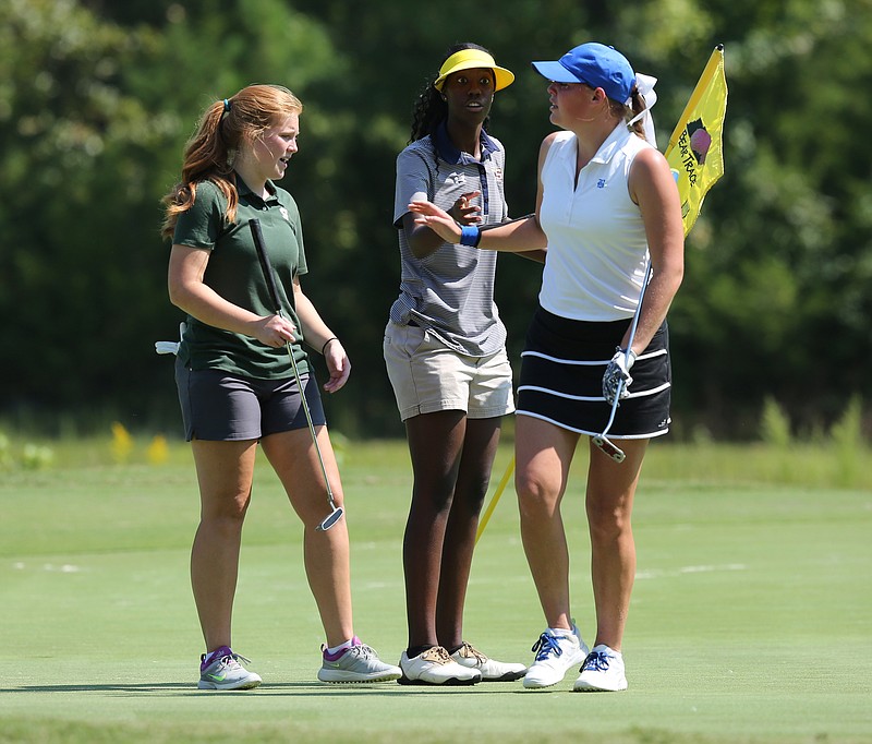 Boyd-Buchanan's Zacori Hill, right, says goodbye to the others in her group on the 11th green after withdrawing with an injury from last week's Division II East District 2-A tournament at The Bear Trace at Harrison Bay. Hill expect to be able to play in Tuesday's East Region tournament at Three Ridges in Knoxville.
