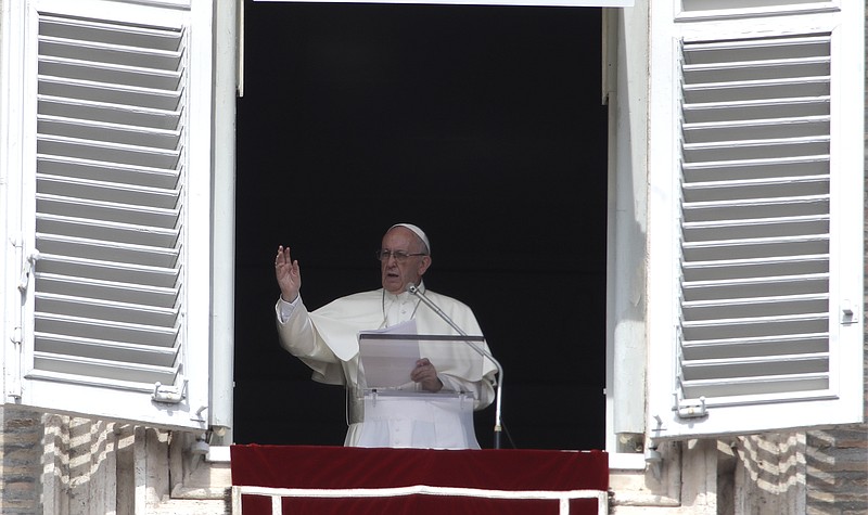 
              Pope Francis delivers his blessing during the Angelus noon prayer from the window of his studio overlooking St. Peter's Square, at the Vatican, Sunday, Sept. 24, 2017. (AP Photo/Alessandra Tarantino)
            