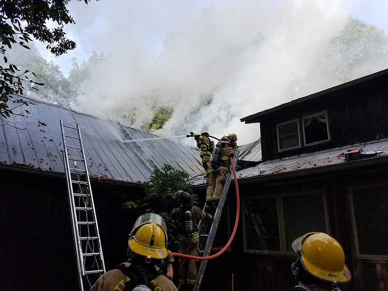 Firefighters work to extinguish a house fire on the 1200 block of O'Grady Drive in Lookout Valley on Sunday, Sept. 24, 2017. (Photo by Capt. Brent Arnold)