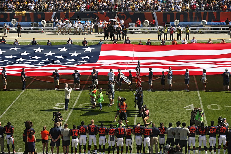 
              The Pittsburgh Steelers side of the field is nearly empty during the playing of the national anthem before an NFL football game between the Steelers and Chicago Bears, Sunday, Sept. 24, 2017, in Chicago. The Pittsburgh Steelers players did not come out to the field during the anthem. (AP Photo/Kiichiro Sato)
            