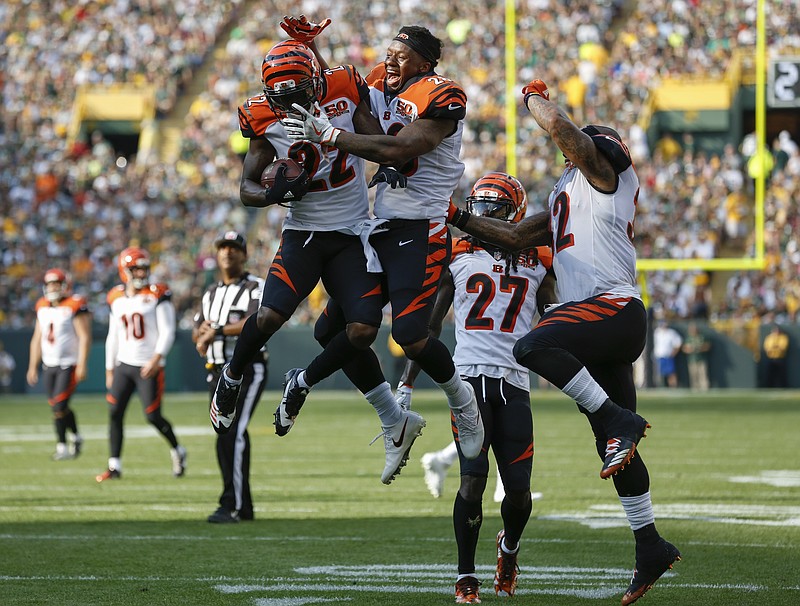 
              Cincinnati Bengals' William Jackson celebrates his interception and return for a touchdown with teammate Joe Mixon during the first half of an NFL football game against the Green Bay Packers Sunday, Sept. 24, 2017, in Green Bay, Wis. (AP Photo/Matt Ludtke)
            