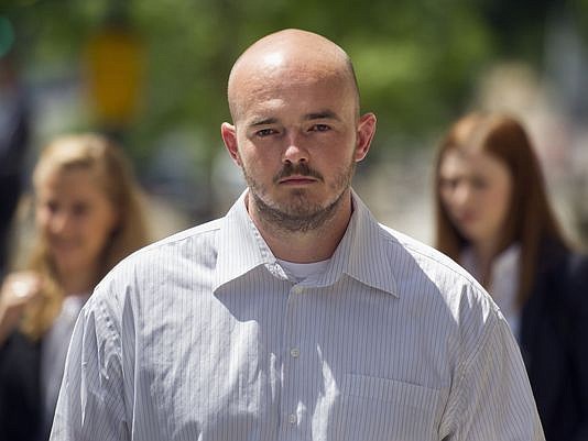 Former Blackwater Worldwide guard Nicholas Slatten leaving federal court in Washington in June 2014. He was convicted Oct. 22, 2014, of murder in the 2007 shooting that killed 14 Iraqis in Baghdad. Three co-defendants were found guilty of manslaughter and other charges..
(Cliff Owen, AP)