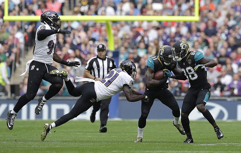 
              Jacksonville Jaguars wide receiver Marqise Lee (11) runs against the Baltimore Ravens defense during the first half of an NFL football game at Wembley Stadium in London, Sunday Sept. 24, 2017. (AP Photo/Matt Dunham)
            