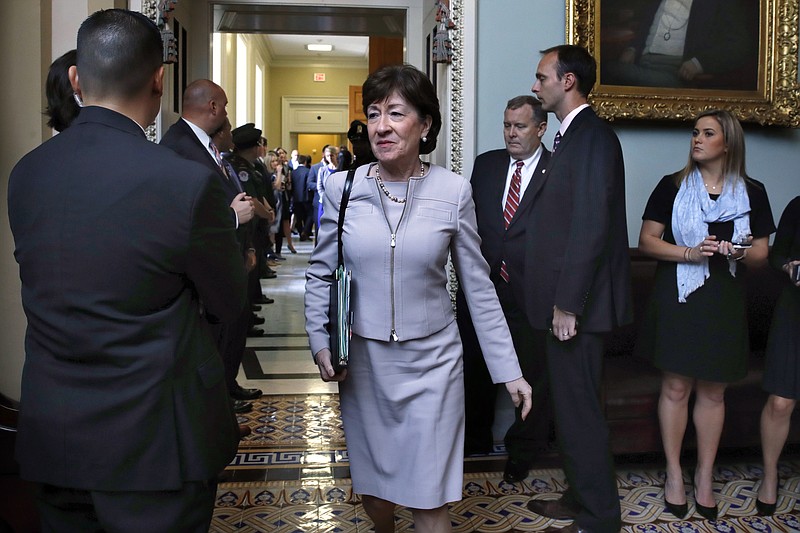 
              Sen. Susan Collins, R-Maine, center, leaves a meeting with Senate Republicans Tuesday, Sept. 19, 2017, on Capitol Hill in Washington. (AP Photo/Jacquelyn Martin)
            