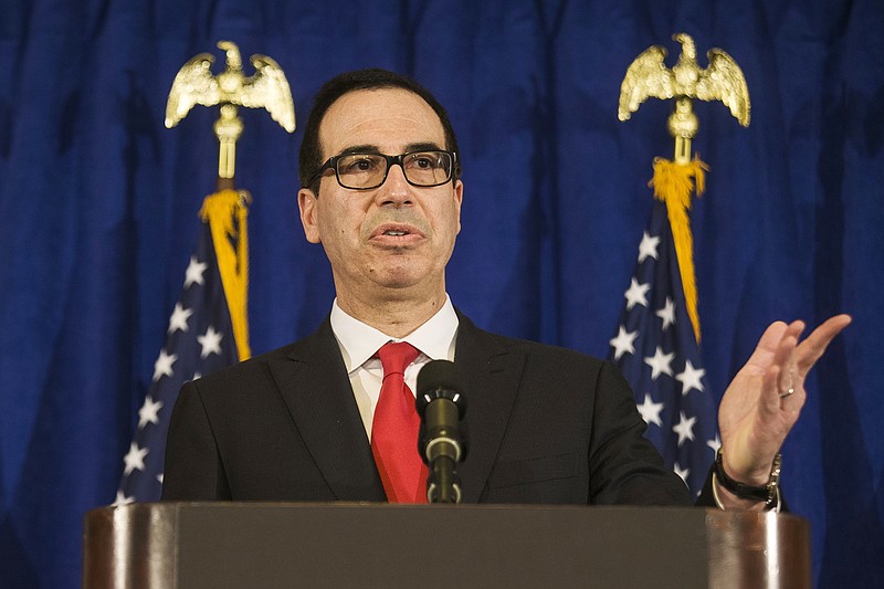 
              FILE - In this Thursday, Sept. 21, 2017, file photo, Treasury Secretary Steven Mnuchin speaks at a press briefing at the Hilton Midtown hotel during the United Nations General Assembly, in New York. Mnuchin is defending President Donald Trump’s attacks on football players kneeling during the national anthem, saying they have “the right to have the First Amendment off the field.” Mnuchin said Sunday, Sept. 24, on ABC’s “This Week.” (AP Photo/Andres Kudacki, File)
            
