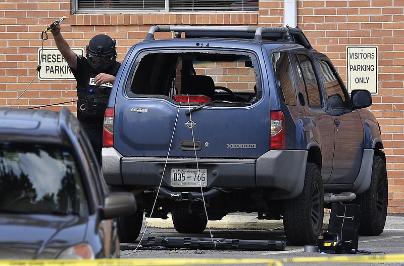 
              Police investigate the scene outside the Burnette Chapel Church of Christ after a deadly shooting at the church on Sunday, Sept. 24, 2017, in Antioch, Tenn. (Andrew Nelles/The Tennessean via AP)
            