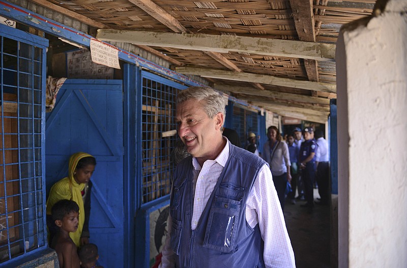 
              United Nations High Commissioner for Refugees Filippo Grandi visits a school that has been turned to a temporary camp for newly arrived Rohingya Muslims at Kutupalong, Bangladesh, Saturday, Sept. 23, 2017. More than 400,000 ethnic Rohingya Muslims have poured into Bangladesh since the latest wave of violence exploded in their nearby home of Myanmar last month. The crisis has drawn global condemnation, with the United Nations and human rights groups calling on Myanmar to end what they describe as a systematic campaign of ethnic cleansing. (AP Photo/Ziaul Haque Oisharjh)
            