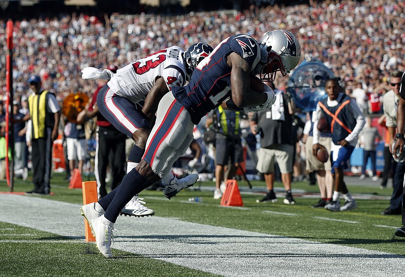 
              New England Patriots wide receiver Brandin Cooks, right, drags his toes as he makes the game-winning catch in the end zone for a touchdown in front of Houston Texans safety Corey Moore, left, during the second half of an NFL football game, Sunday, Sept. 24, 2017, in Foxborough, Mass. The Patriots won 36-33. (AP Photo/Michael Dwyer)
            