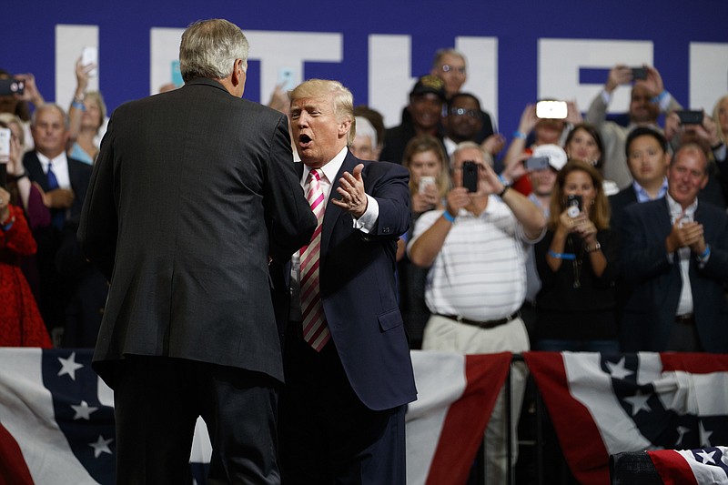 
              President Donald Trump, second from left, greets U.S. Senate candidate Luther Strange after speaking at a campaign rally, Friday, Sept. 22, 2017, in Huntsville, Ala. (AP Photo/Evan Vucci)
            