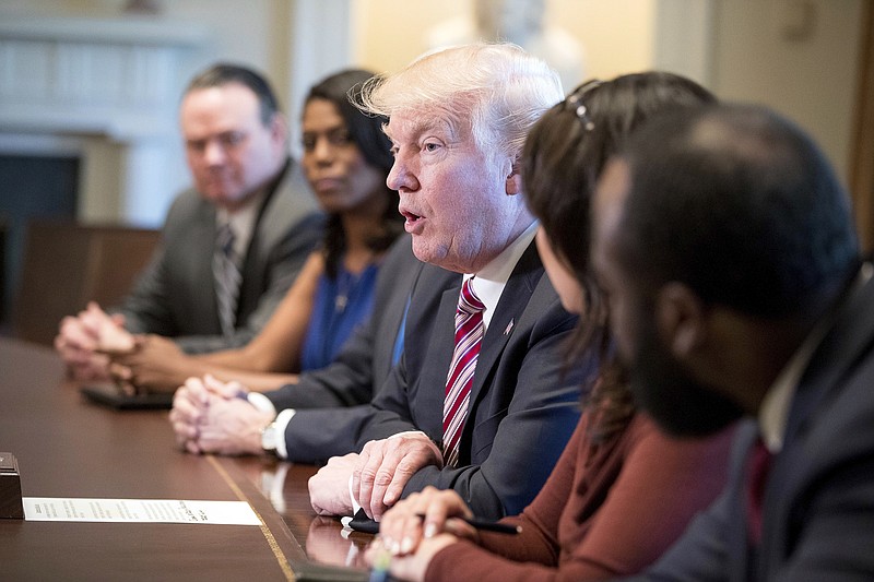 
              FILE - In this March 22, 2017, file photo, President Donald Trump meets with members of the Congressional Black Caucus in the Cabinet Room of the White House in Washington. On the campaign trail last year, then-Republican presidential nominee Donald Trump sought the support of black voters by asking them, “What the hell do you have to lose?” An answer came during the Congressional Black Caucus’ annual legislative conference this past week: Everything. (AP Photo/Andrew Harnik, File)
            