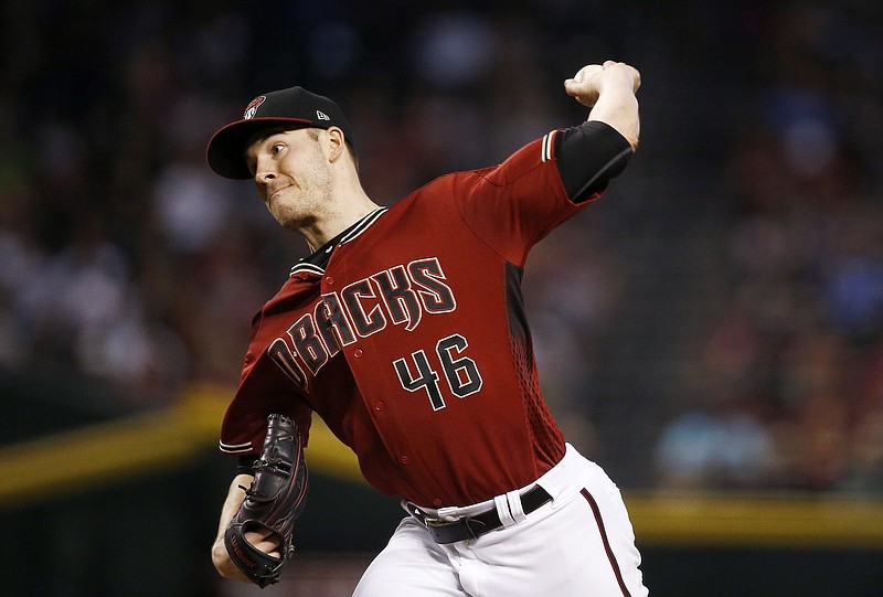 
              Arizona Diamondbacks' Patrick Corbin throws a pitch against the Miami Marlins during the first inning of a baseball game Sunday, Sept. 24, 2017, in Phoenix. (AP Photo/Ross D. Franklin)
            