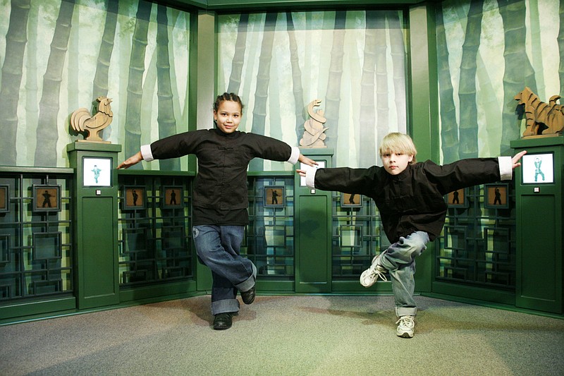 Children play in the Kung Fu Forest of Run! Jump! Fly! exhibit.