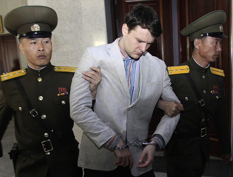 
              FILE – In this March 16, 2016, file photo, American student Otto Warmbier, center, is escorted at the Supreme Court in Pyongyang, North Korea. Fred and Cindy Warmbier, the parents of a young Ohioan who was detained in North Korea for more than a year and died soon after being released, appeared on Fox News' "Fox & Friends" morning TV show Tuesday, Sept. 26, 2017, saying their son was "jerking violently," howling, and "staring blankly" when he returned home on a medical flight that arrived June 13 in Cincinnati. He died less than a week after returning at University of Cincinnati Medical Center. (AP Photo/Jon Chol Jin, File)
            