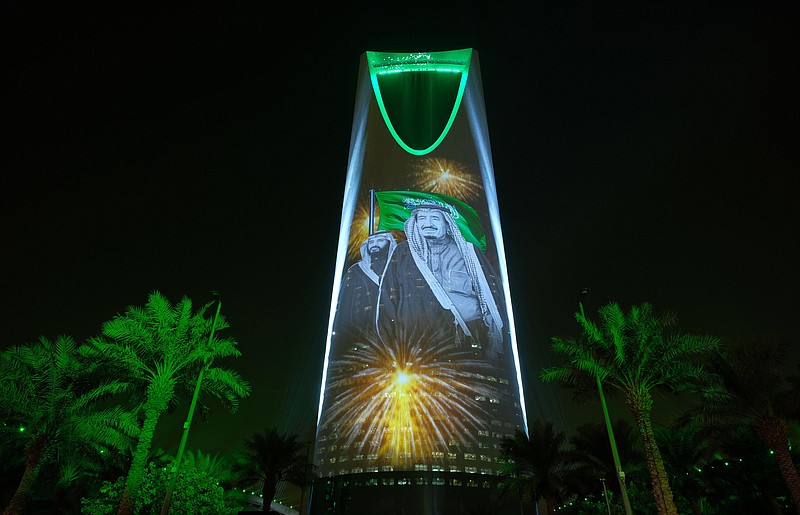 
              In this Sunday, Sept. 24, 2017 photo released by the Saudi Culture and Information Ministry, the image of King Salman and Crown Prince Mohammed bin Salman are projected on the Kingdom Tower during National Day ceremonies in Riyadh, Saudi Arabia. A new 62-page report by Human Rights Watch finds that despite Saudi Arabia's recent efforts toward reform, some state-backed clerics continue to "incite hatred and discrimination against religious minorities" while text books stigmatize minorities, particularly Muslim Shiites. (Saudi Culture and Information Ministry via AP)
            