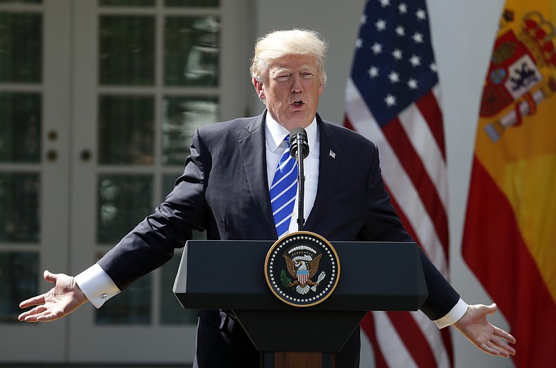 
              President Donald Trump speaks during a news conference with Spanish Prime Minister Mariano Rajoy in the Rose Garden of the White House, Tuesday, Sept. 26, 2017, in Washington. (AP Photo/Alex Brandon)
            