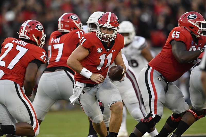 Georgia quarterback Jake Fromm (11) works against Mississippi State during the first of an NCAA college football game, Saturday, Sept. 23, 2017, in Athens, Ga. (AP Photo/Mike Stewart)