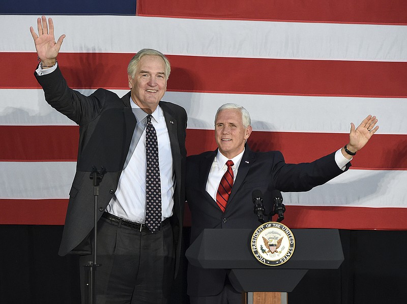 Vice President Mike Pence, right, makes a campaign stop to support Sen. Luther Strange in Birmingham, Ala., Monday, Sept. 25, 2017. President Donald Trump called an Alabama radio show Monday to urge support for Strange in Tuesday's runoff for the GOP nomination, and Pence campaigned for Strange in Birmingham while Trump's former strategist, Steve Bannon, spoke at a Moore rally at the coast. (Joe Songer/AL.com via AP)