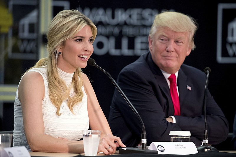 
              FILE - In this June 13, 2017, file photo, President Donald Trump, right, listens as his daughter, Ivanka Trump, speaks at a workforce development roundtable at Waukesha County Technical College in Pewaukee, Wis. It is no secret that the bulk of Ivanka Trump’s merchandise comes from China. But just which Chinese companies manufacture and export her handbags, shoes and clothes is more secret than ever, an Associated Press investigation has found. Since she took on her White House role at the end of March, 90 percent of the shipments of her merchandise do not include public disclosure of the companies that sent the goods to the U.S., data shows. (AP Photo/Andrew Harnik, File)
            