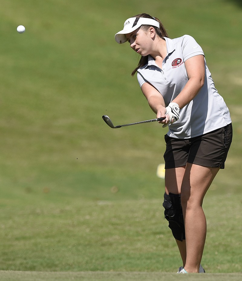 Signal Mountain's Lindsey Hollis chips onto the ninth green at Bear Trace at Harrison Bay during the City Prep tournament this month.