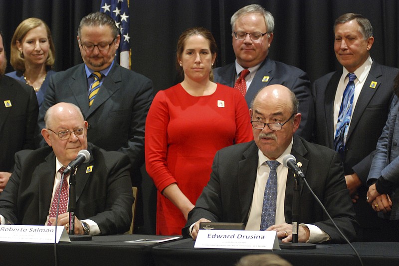 
              U.S. Commissioner of the International Boundary and Water Commission Edward Drusina, right, seated, announces the expansion of a far-reaching water conservation agreement that governs how the U.S. and Mexico manage the overused Colorado River, at a news conference in Santa Fe, N.M., on Wednesday, Sept. 27, 2017. (AP Photo/Morgan Lee)
            