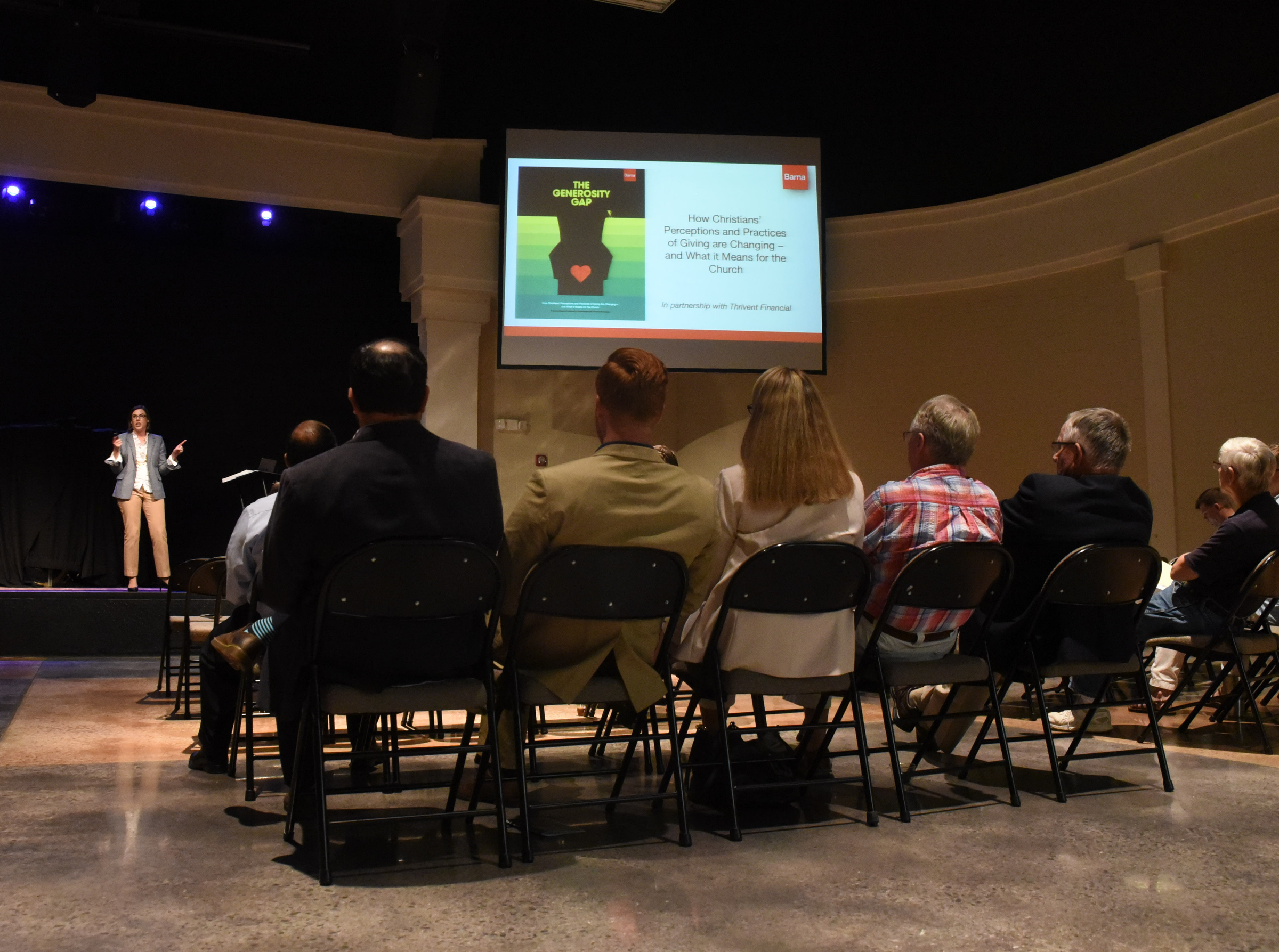 Brooke Hempell, stage left, senior vice president at Barna Research, talks to local pastors about who is in their community, fostering generosity
and kindness, and faith, beliefs and practices Wednesday at Brainerd Baptist Church.