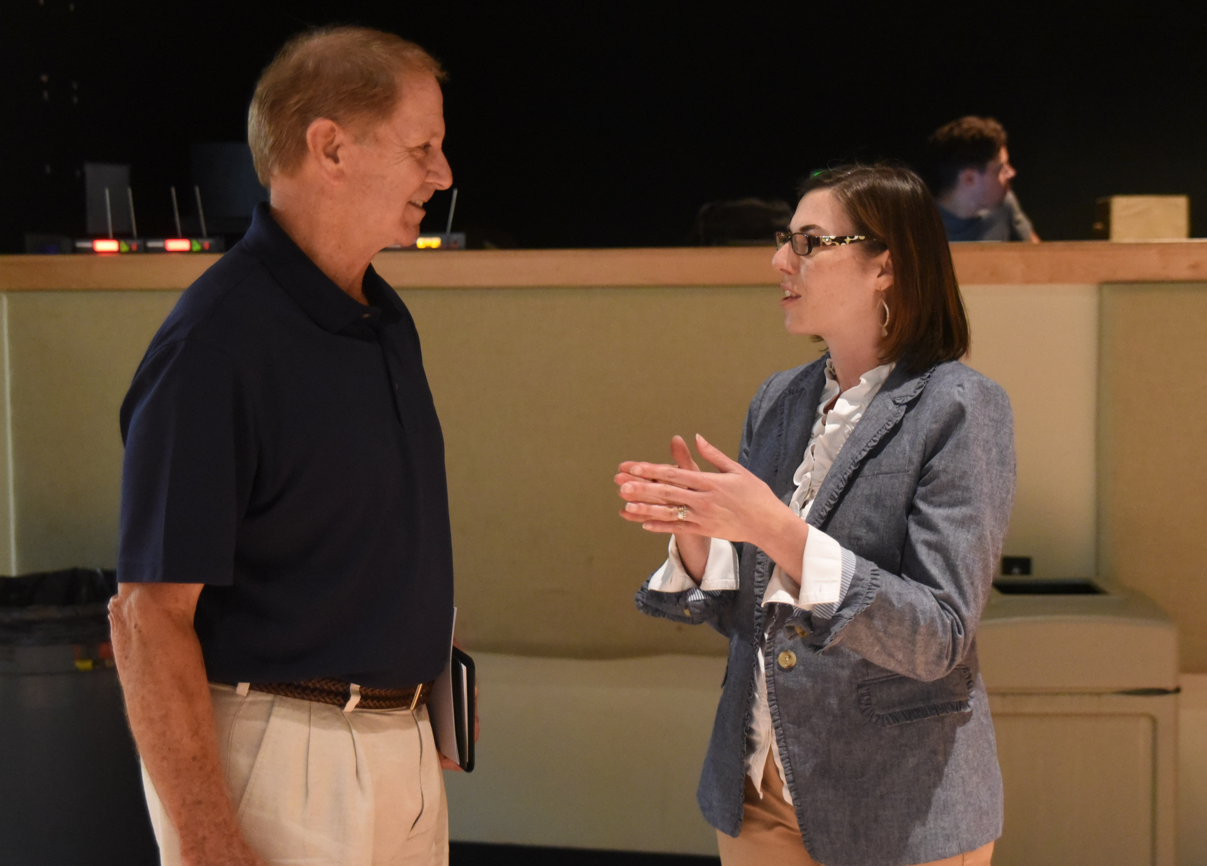 Brainerd Baptist Biblical World View teacher Paul Shearer, left, listens to Brooke Hempell, senior vice president at Barna Research, prior to her talk to local pastors about research statistics on generosity, faith beliefs and practices here and across the country.