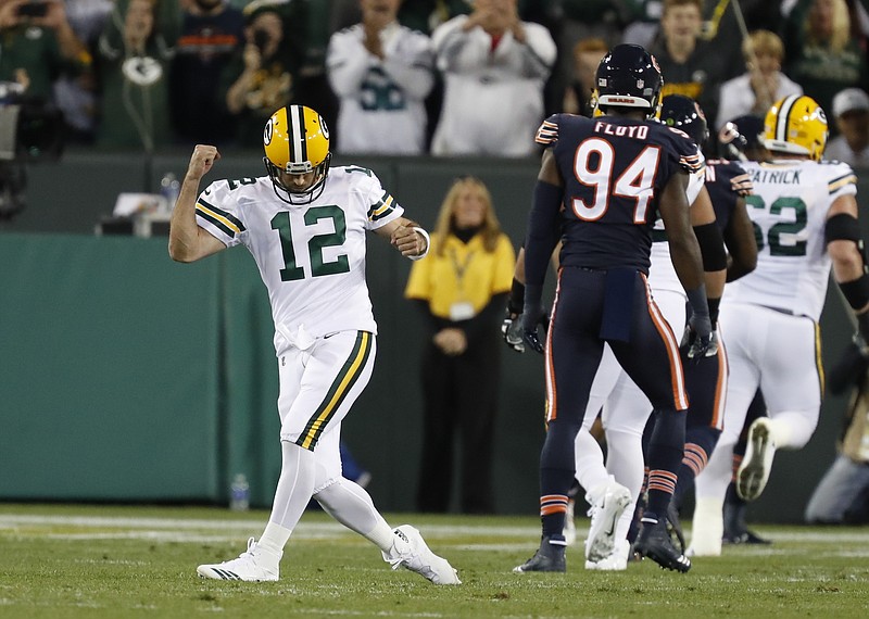 
              Green Bay Packers' Aaron Rodgers celebrates a touchdown pass during the first half of an NFL football game against the Chicago Bears Thursday, Sept. 28, 2017, in Green Bay, Wis. (AP Photo/Matt Ludtke)
            