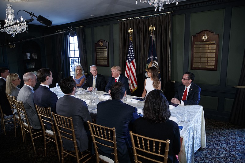 
              FILE - In this Aug. 8, 2017, file photo, President Donald Trump speaks during a briefing on the opioid crisis, at Trump National Golf Club in Bedminster, N.J. From left are, White House senior adviser Kellyanne Conway, Health and Human Services Secretary Tom Price, Trump, first lady Melania Trump, and National Drug Control Policy acting Director Richard Baum. Melania Trump has invited experts and people affected by addiction to opioids to the White House for a listening session and discussion about the epidemic. The first lady is hosting the Sept. 28 event in the State Dining Room and has invited journalists to attend a portion of the meeting to help raise awareness. (AP Photo/Evan Vucci, File)
            