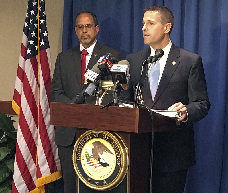 U.S. Attorney Jay Town, right, discusses the indictment of two prominent lawyers and a coal executive during a news conference in Birmingham, Ala., on Thursday, Sept. 28, 2017. Town said the three men are accused of conspiring to bribe a former state legislator who previously pleaded guilty in a scheme to lessen the impact of an environmental cleanup. At left is Angel Castillo, the FBI's acting assistant special agent in charge. (AP Photo/Jay Reeves)