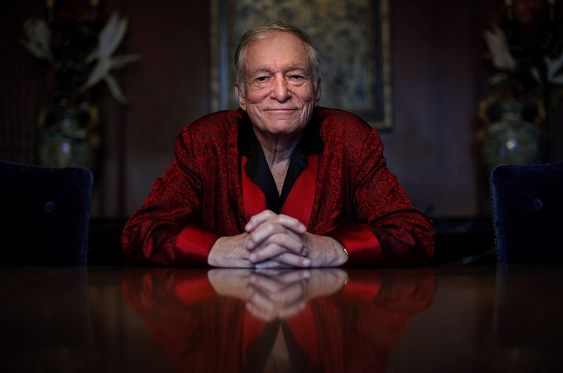 FILE - In this Nov. 4, 2010, file photo, Playboy magazine founder Hugh Hefner poses for photos at the Playboy Mansion in Los Angeles. The Playboy magazine founder and sexual revolution symbol Hefner has died at age 91. The magazine released a statement saying Hefner died at his home of natural causes on Wednesday night, Sept. 27, 2017, surrounded by family. (AP Photo/Jae C. Hong, File)