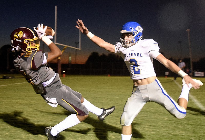 Tyner's Jeremiah Batiste pulls in a pass for the Ram's first touchdown during Friday night's 42-9 homecoming victory. Defending on the play is Bledsoe County's Colby Rogers.