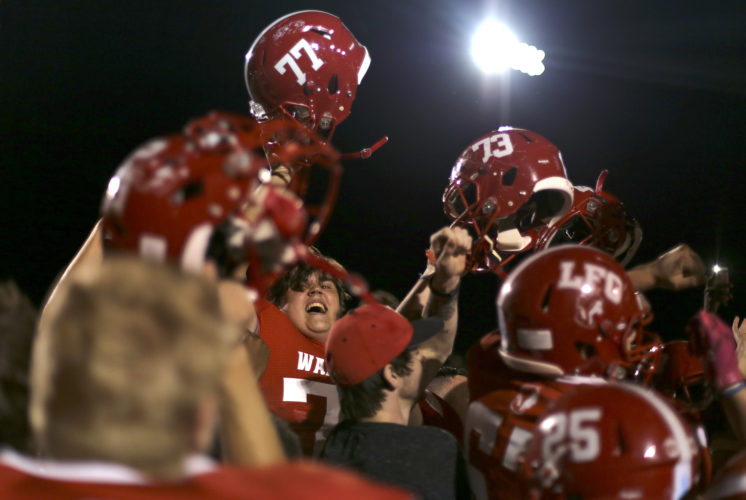 Lakeview-Fort Oglethorpe's Michael Crisp (77) celebrates with his teammates and fans after their 28-23 victory over Ringgold at Lakeview-Fort Oglethorpe High School's Tommy Cash Stadium on Friday, Sept. 29, in Fort Oglethorpe, Ga.