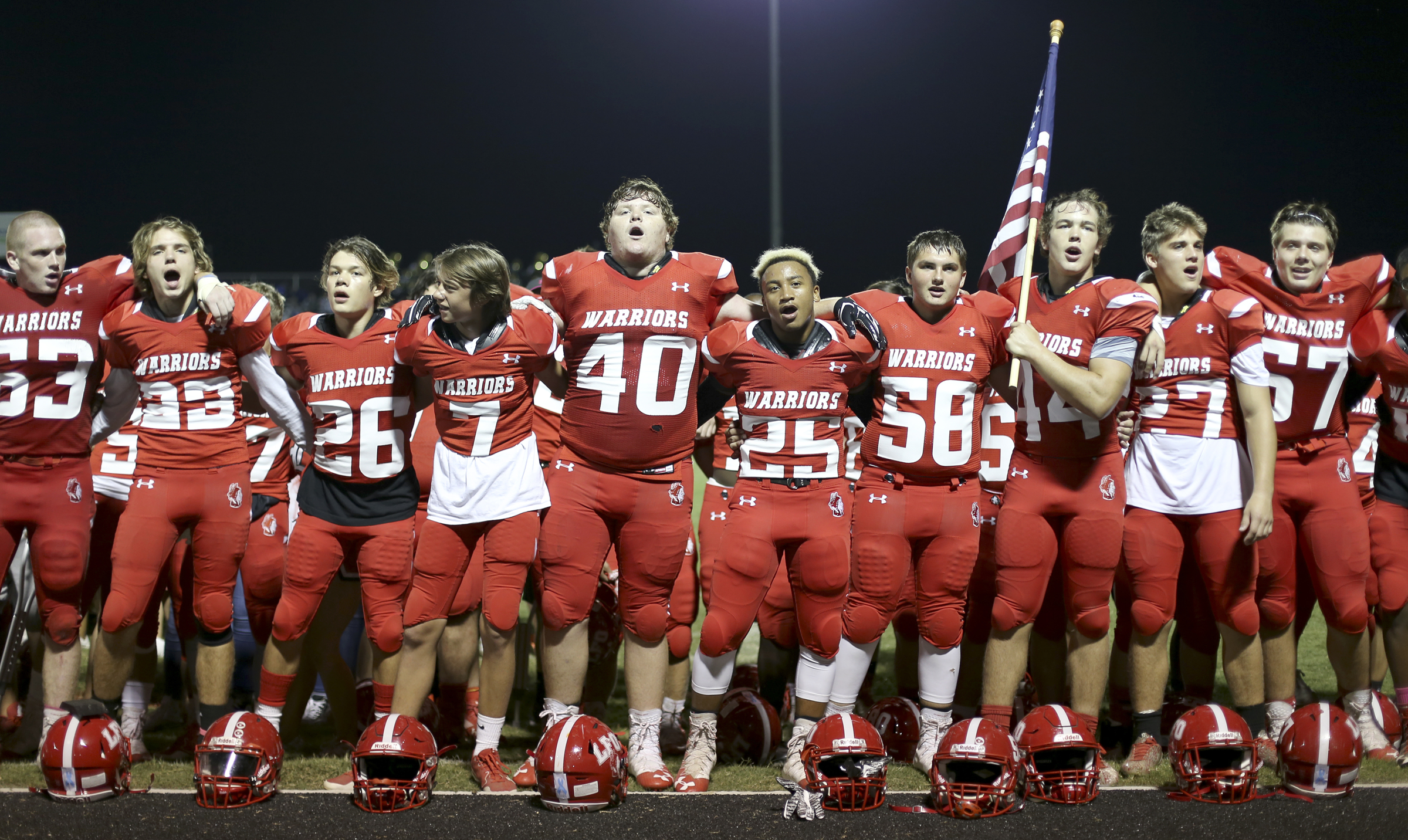 The Lakeview-Fort Oglethorpe Warriors sing along with the band after their 28-23 victory over Ringgold at Lakeview-Fort Oglethorpe High School's Tommy Cash Stadium on Friday, Sept. 29, in Fort Oglethorpe, Ga.