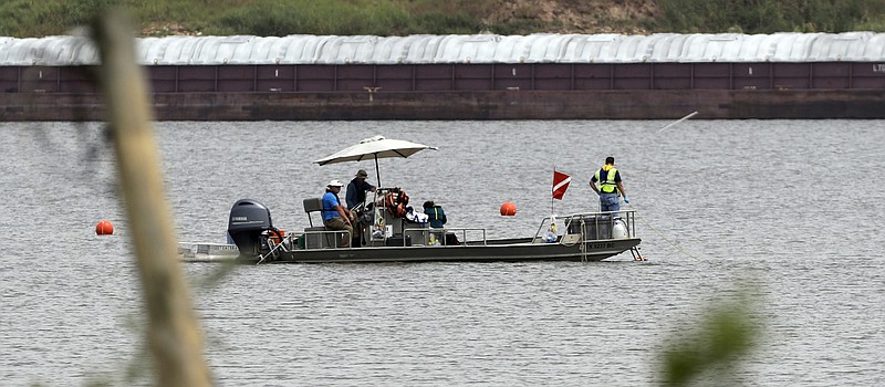 
              In this Sept. 13, 2017 photo, a boat with a dive flag is shown at San Jacinto River Waste Pits near the Interstate 10 bridge over the river in Channelview, Texas. The Environmental Protection Agency says an unknown amount of a dangerous chemical linked to birth defects and cancer may have washed downriver from a Houston-area Superfund site during the flooding from Hurricane Harvey.  (AP Photo/David J. Phillip)
            