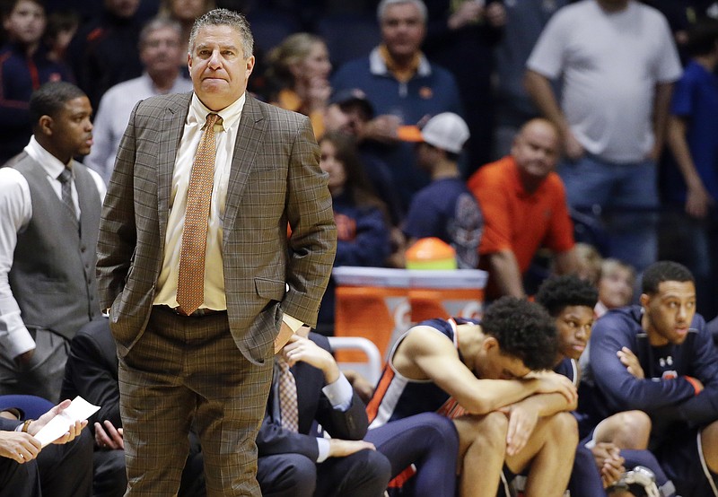 In this Dec. 12, 2015, file photo, Auburn head coach Bruce Pearl watches during the second half of an NCAA college basketball game against Middle Tennessee, in Nashville, Tenn. Pearl's efforts to infuse a once-moribund Auburn basketball program have been derailed after his associate head coach's arrest as part of a nationwide federal bribery investigation of college basketball. The Tigers' program is in murky waters with practice set to begin Friday after the arrest of associate head coach Chuck Person. (AP Photo/Mark Humphrey, File)