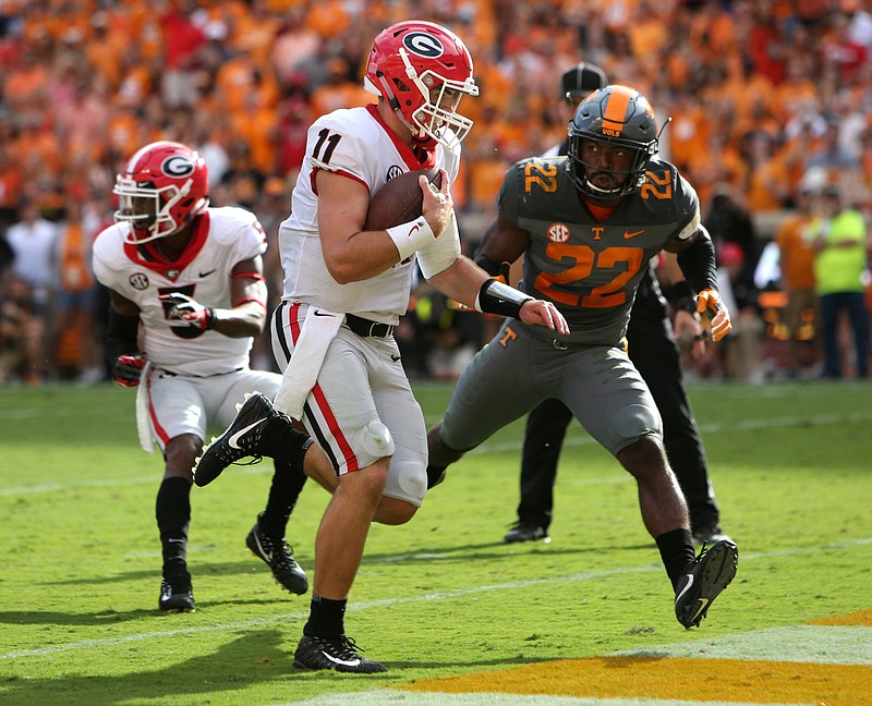 University of Georgia quarterback Jake Fromm (11) runs the ball into the end zone for a touchdown during the first half of the University of Tennessee vs. University of Georgia football game at Neyland Stadium in Knoxville, Tenn., Saturday, Sept. 30, 2017.