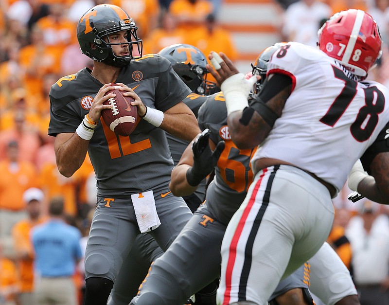 Tennessee quarterback Quinten Dormady looks for a receiver with the pocket growing smaller during Saturday's home loss to Georgia.