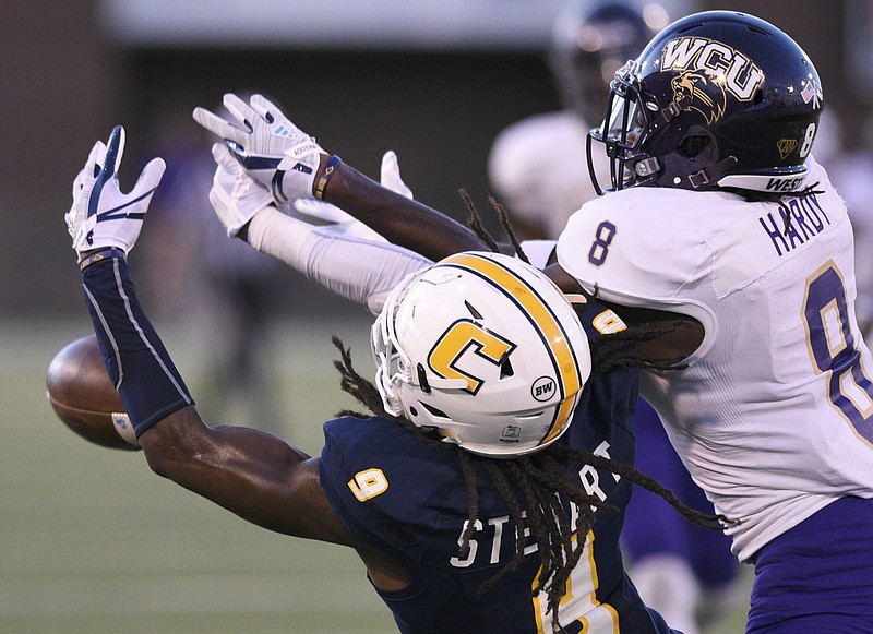 UTC wide receiver Alphonso Stewart cannot bring in this pass as he is defended by Western Carolina's Tra Hardy (8) during WCU's 45-7 Southern Conf'erence victory Saturday at Finley Stadium.
