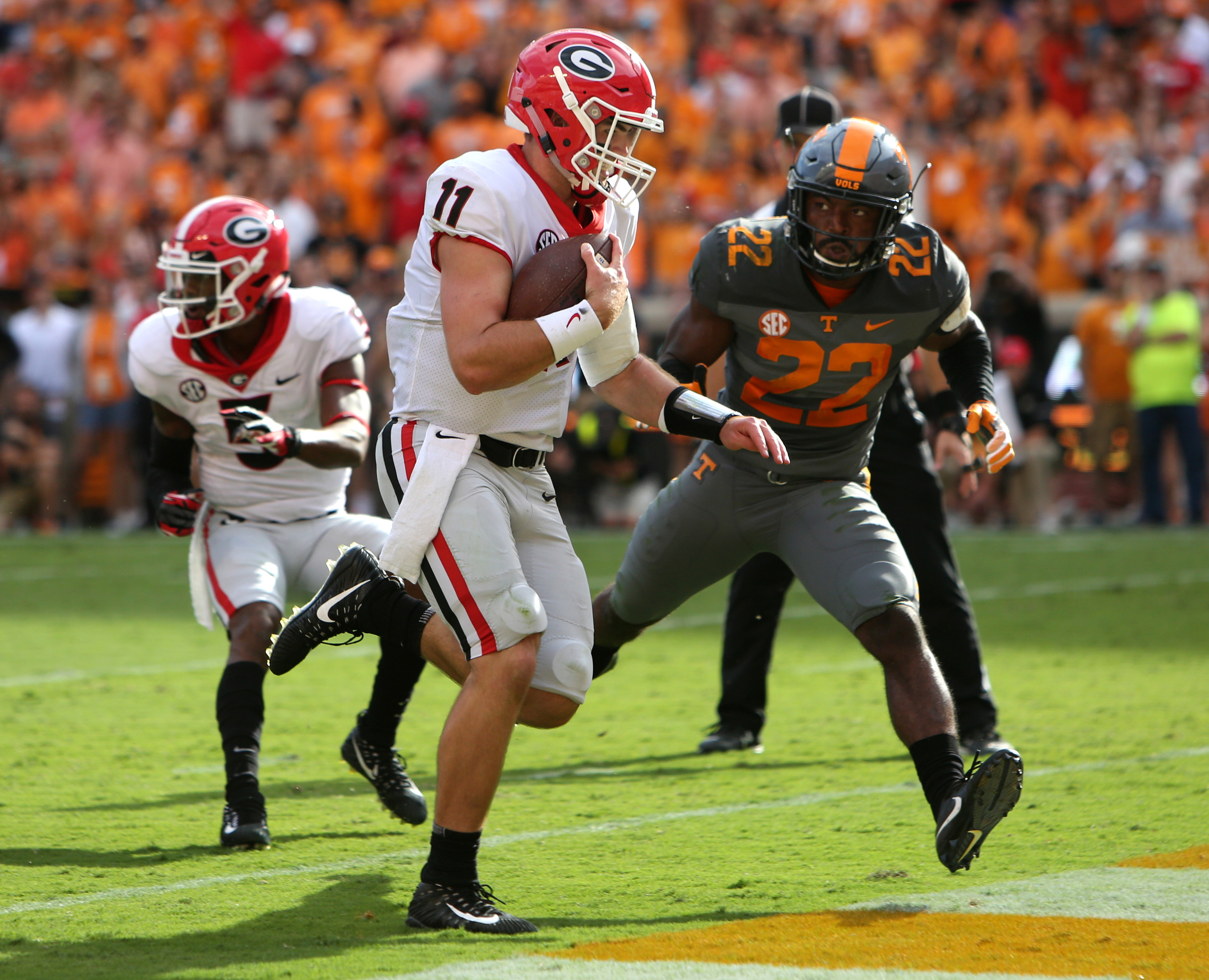 University of Georgia quarterback Jake Fromm (11) runs the ball into the end zone for a touchdown during the first half of the University of Tennessee vs. University of Georgia football game at Neyland Stadium in Knoxville, Tenn., Saturday, Sept. 30, 2017.