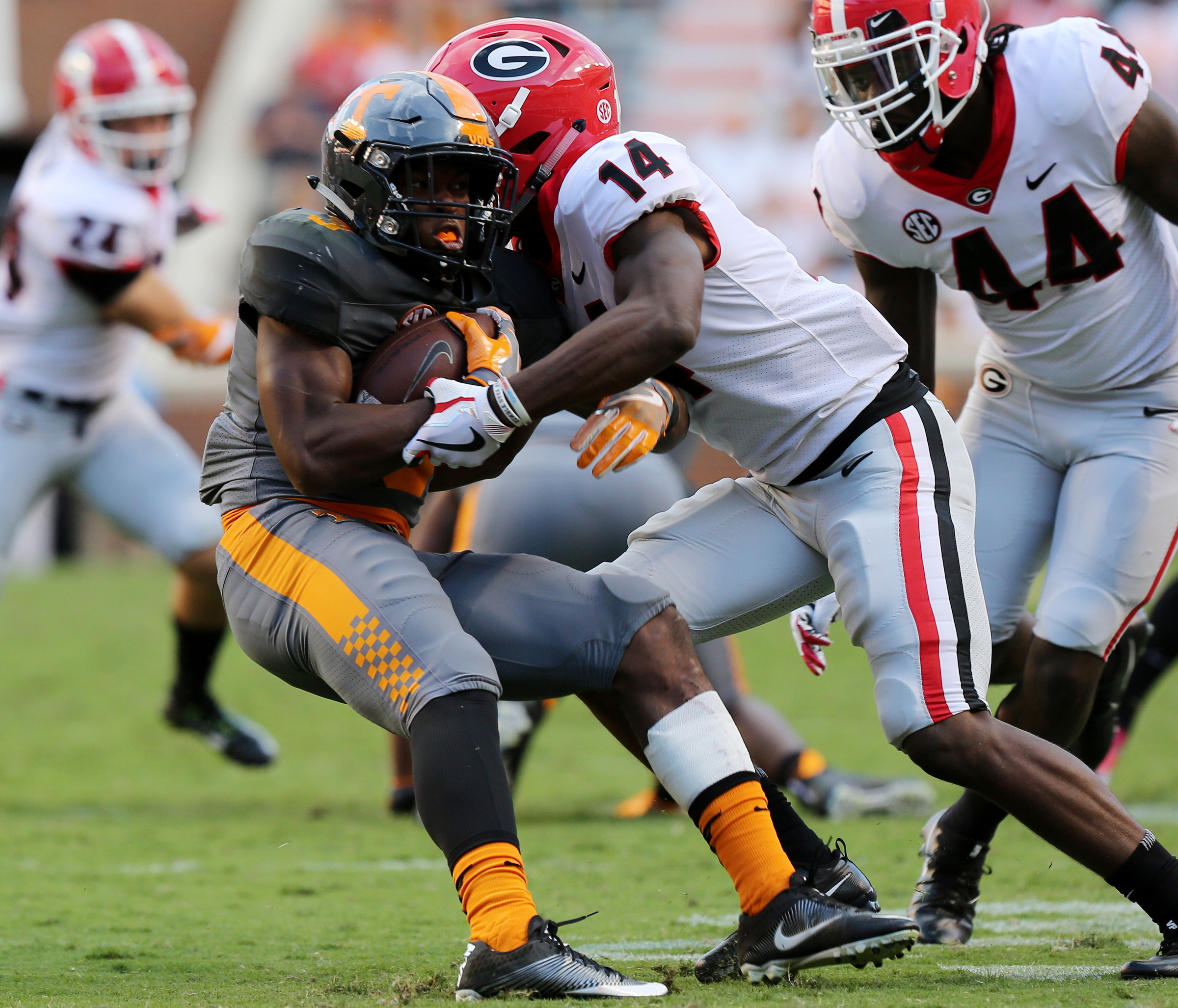 Georgia cornerback Malkom Parrish wraps up Tennessee tailback Ty Chandler during Saturday's 41-0 rout by the Bulldogs. The Vols managed just 62 rushing yards on 29 carries.